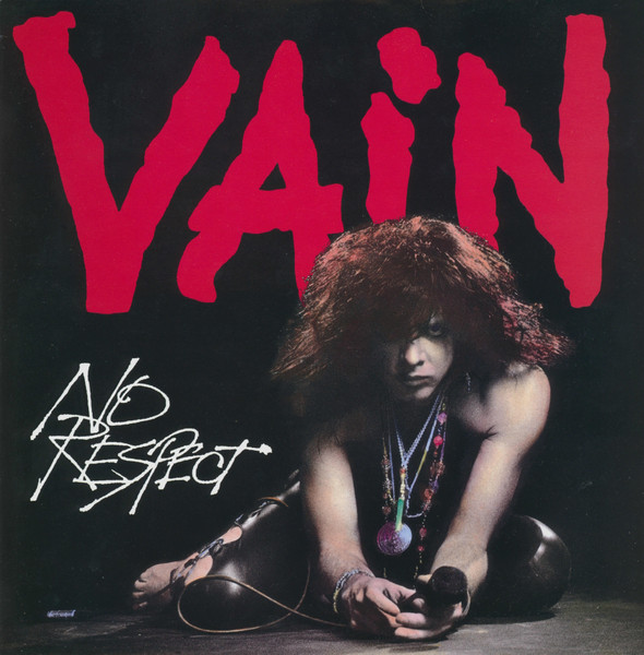 Vain promotional photograph circa 1989, five band members in leather and teased hair against a dark backdrop